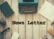 Newsletter, a table and a typewriter